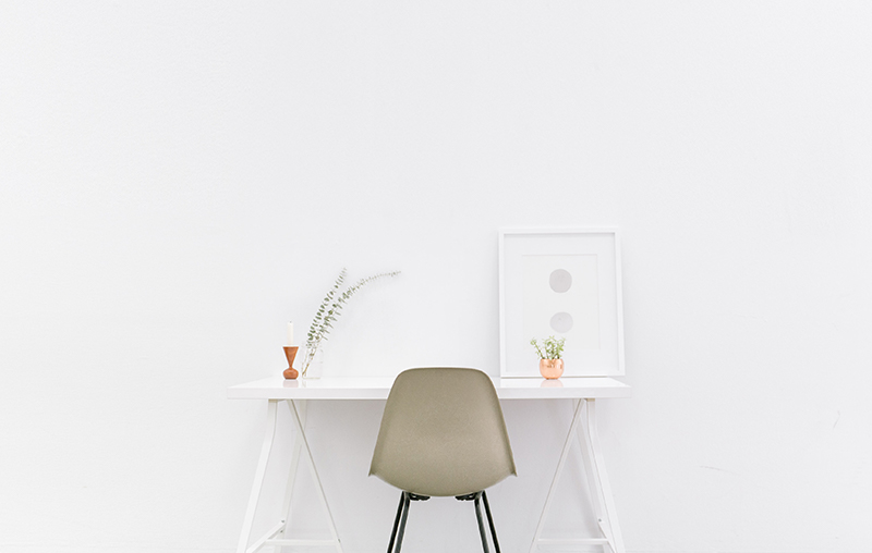 an empty white desk